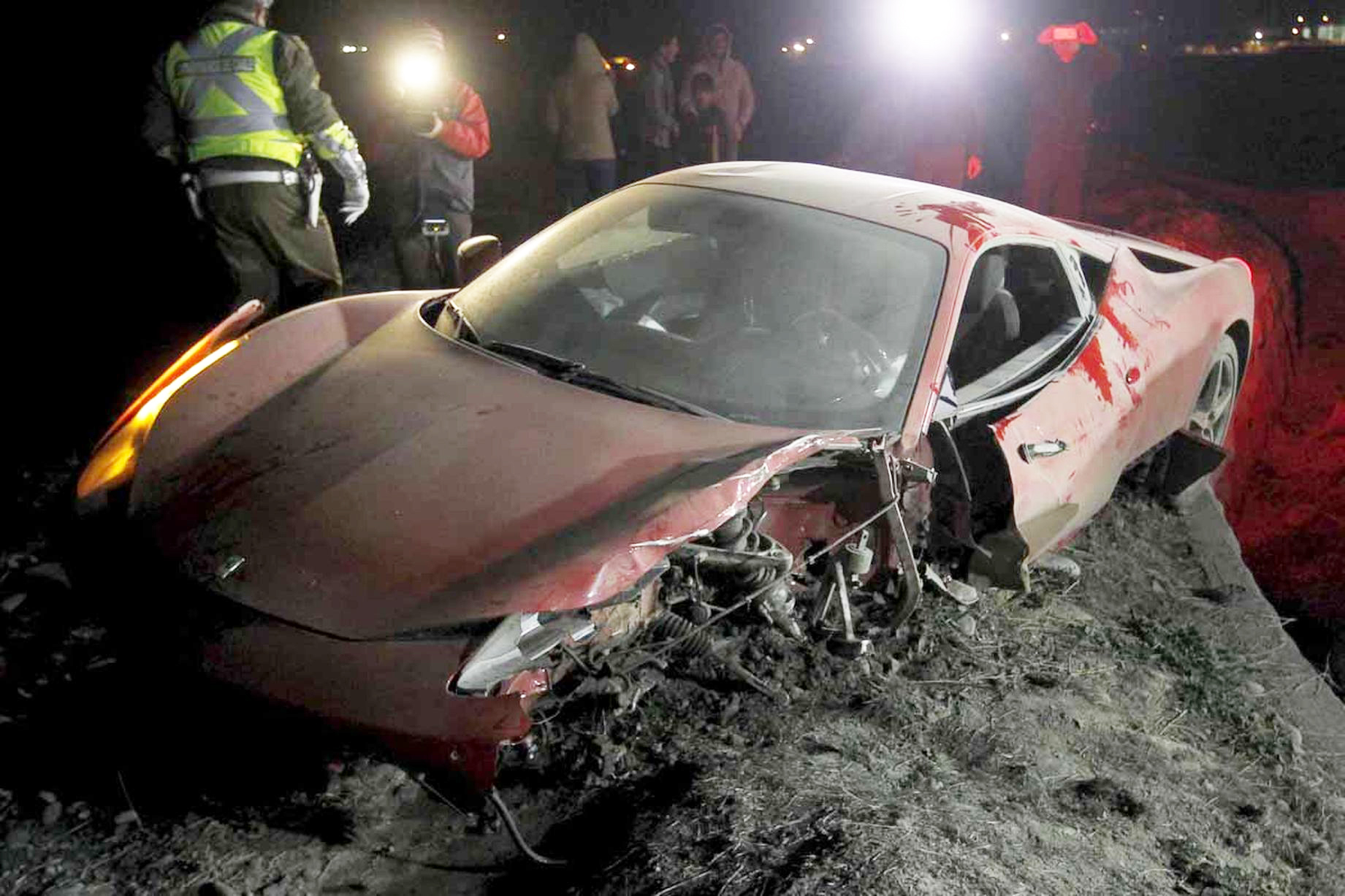 A-red-Ferrari-belonging-to-Arturo-Vidal-is-seen-after-a-car-crash-on-a-highway-south-of-Santiago