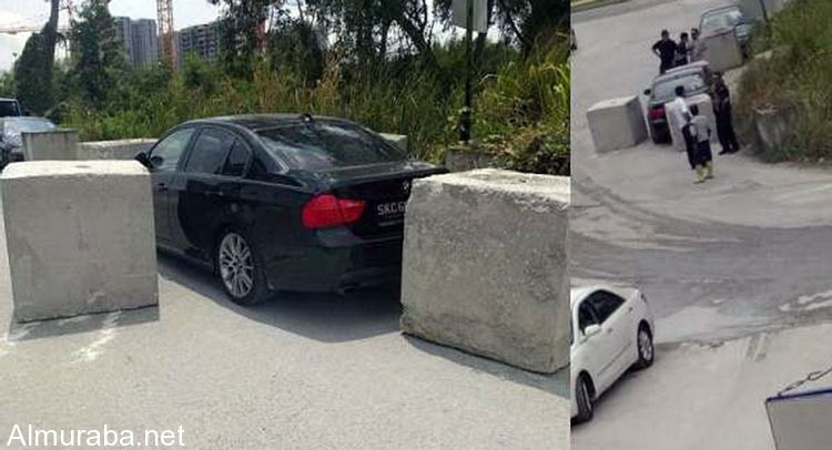 عمال بناء بسنغافورة يلقنون مالك "بي إم دبليو" درسا لركنه سيارته بشكل مخالف 1