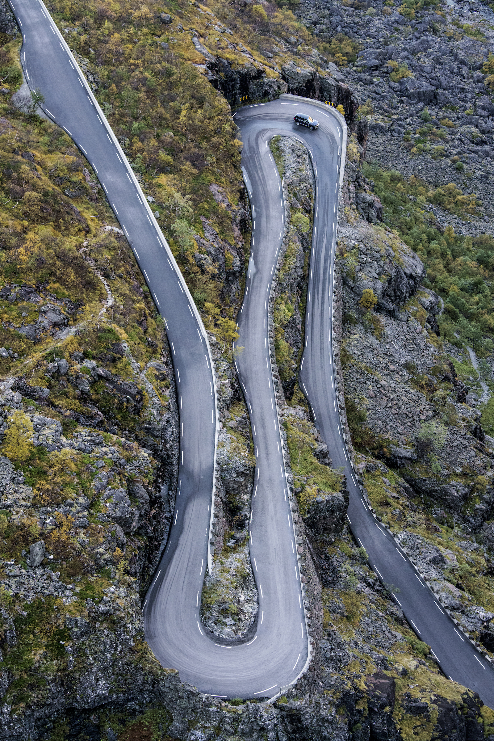 NORWAY. 2016. Trollstigen.  The famous Trollstigen road, a series of switchbacks winding its way through a steep cliffside near Åndalsnes. Photographed on assignment from Land Rover.